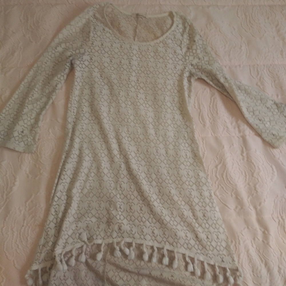 Cream colored long sleeve top